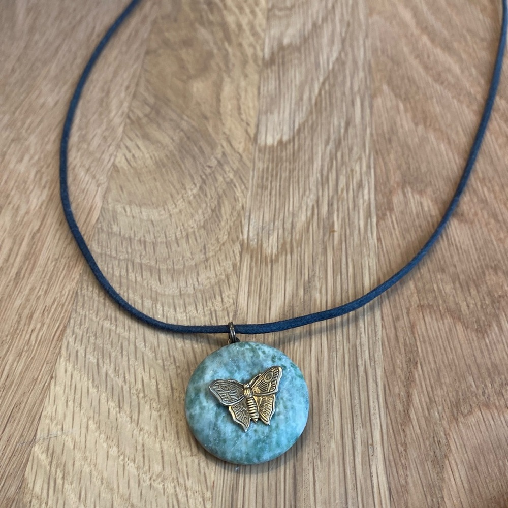 Butterfly gold-toned and green stone necklace. Black cord. So pretty!